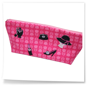 Pinke Kosmetiktasche, mit schwarzen Modemotiven 