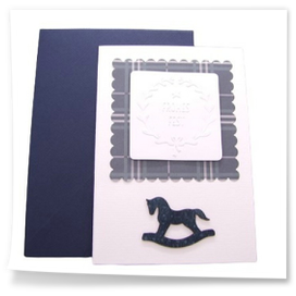 Blaue Weihnachtskarte mit Schaukelpferd